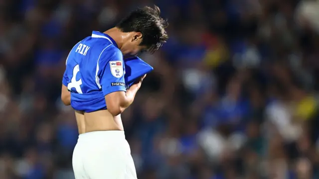 Birmingham City midfielder Paik Seung-ho buries his head in his shirt after their loss to Brentford in the Carabao Cup on Tuesday