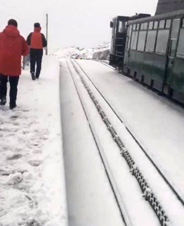 Snow at the summit of Snowdon was causing disruption to the mountain railway