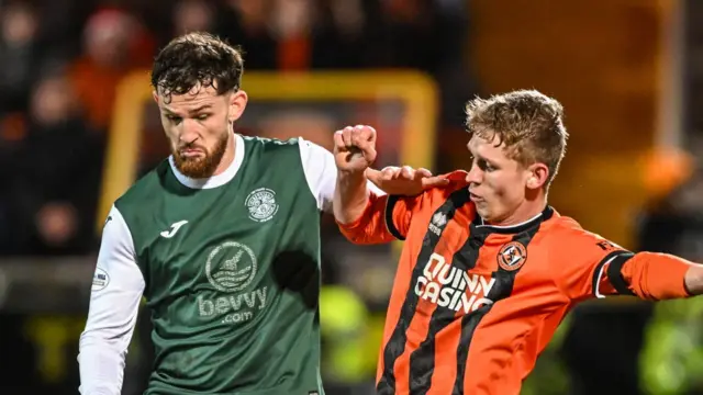 Hibernian's Jack Iredale and Dundee United's Zac Sapsford
