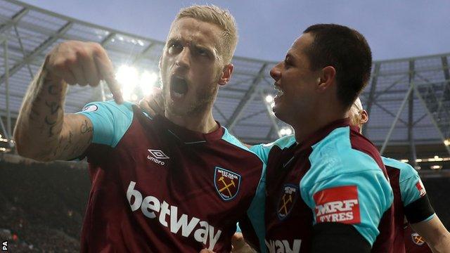 Marko Arnautovic (left) celebrates scoring for West Ham against Watford