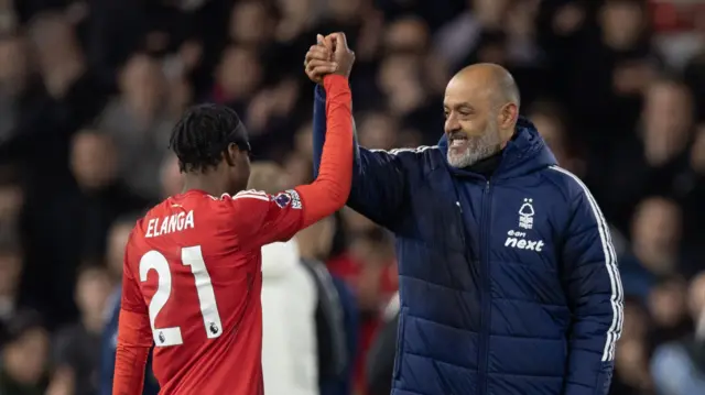 Anthony Elanga and Nuno Espirito Santo celebrate after match