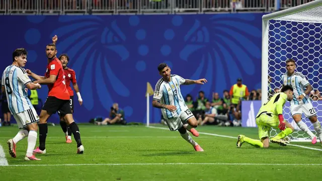 Cristian Romero of Argentina wheels away after scoring against Egypt