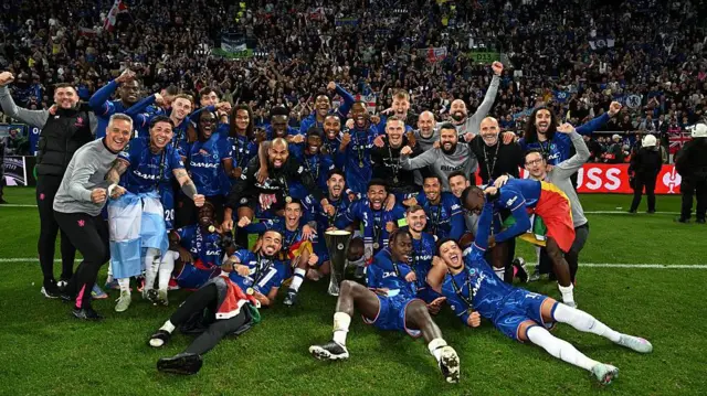 Chelsea players and staff celebrate in front of fans