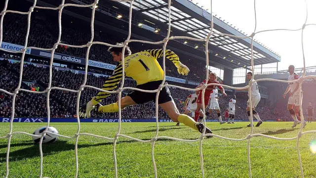 Dirk Kuyt of Liverpool heads in the second goal
