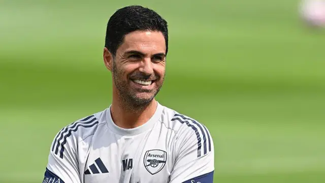 Mikel Arteta, pictured smiling during Arsenal training