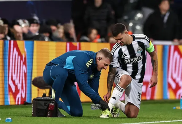 Bruno Guimaraes receives treatment during Newcastle United's game against PSV Eindhoven at St James' Park on 23 January, 2026