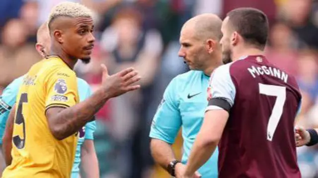 Wolves player argues with the referee