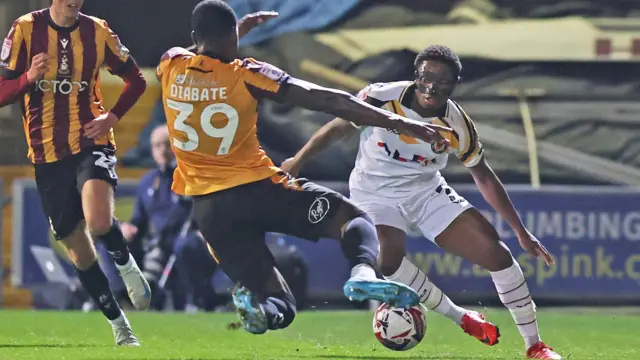 Bobby Kamwa of Newport County and Check Diabate of Bradford City