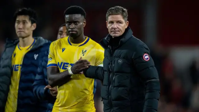Marc Guehi and Oliver Glasner share a handshake after a match