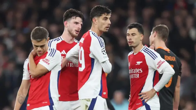 Arsenal players in discussion during match