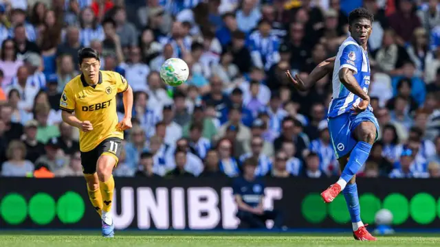 Carlos Baleba crosses the ball against Wolves