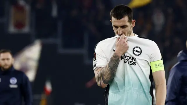 Lewis Dunk dejected after Brighton's loss at Roma