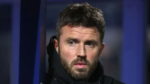 Michael Carrick watching Middlesbrough during their game against QPR