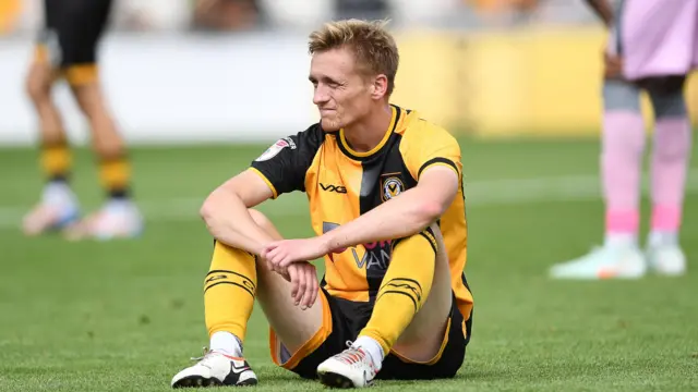 Matt Smith looks dejected after a Newport loss 