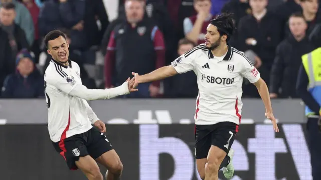 Antonee Robinson and Raul Jiminez celebrate goal