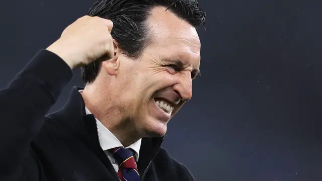 Unai Emery punches the air and smiles 