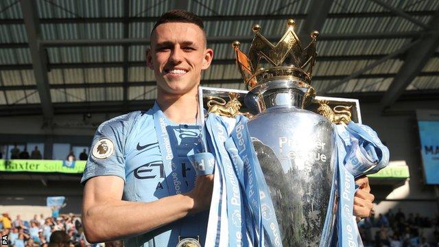 Phil Foden with the Premier League trophy