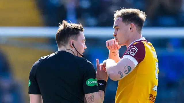Referee Matthew MacDermaid speaks to Motherwell's Kofi balmer before checking VAR and showing him a red card during a William Hill Premiership match between Kilmarnock and Motherwell at the BBSP Stadium Rugby Park