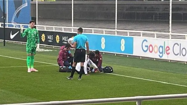 Ayden Heaven being treated on the pitch by physios