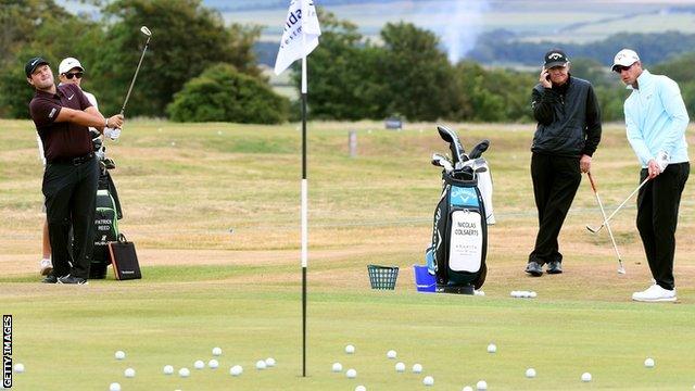 Patrick Reed and Nicolas Colsaerts practise chipping before the 2018 Scottish Open at Gullane