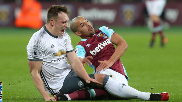 Sofiane Feghouli tackles Manchester United's Phil Jones