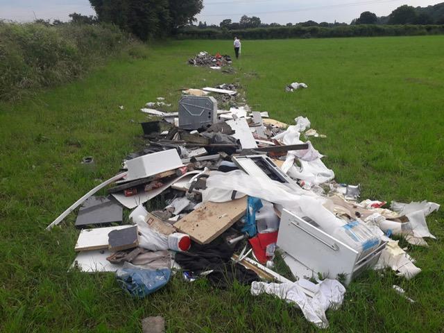 Rubbish strewn over a large area on a farm field