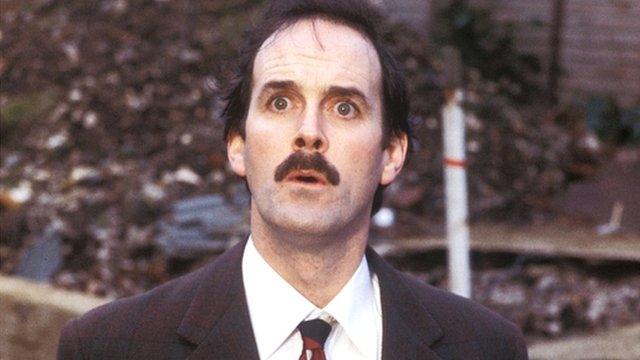 John Cleese as Basil Fawlty