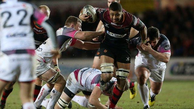 Dragons skipper Taulupe Faletau is tackled by Ospreys duo Rory Thornton and Aaron Jarvis