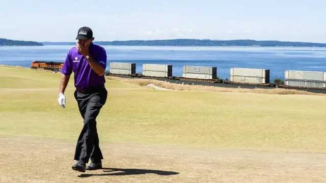 Phil Mickelson walks off the green