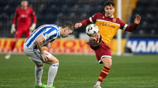 Kilmarnock's Liam Polworth (L) and Motherwell's Davor Zdravkovski (R) in action during a William Hill Premiership match between Kilmarnock and Motherwell 