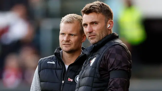 Liam Manning with Chris Hogg in the Bristol City dugout.
