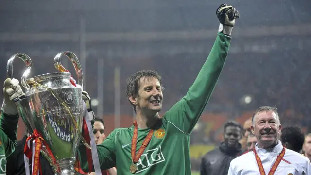 Edwin van Der Sar lifts the Champions League trophy