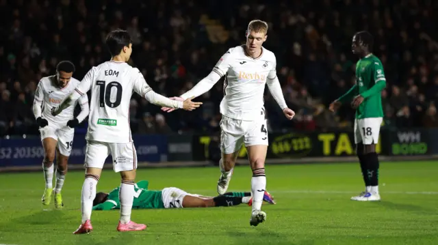 Jay Fulton celebrates his goal at Plymouth with Eom Ji-Sung