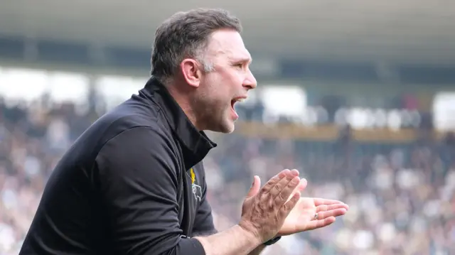 John Eustace claps his Derby County team from his technical area