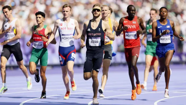 Josh Kerr of Britain reacts after finishing first place in heat 1.