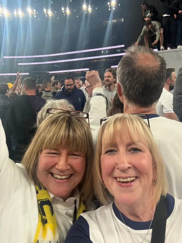 Two sisters at a Spurs game.