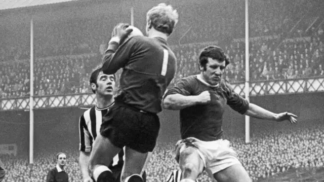 Johnny Morrissey challenges for a ball for Everton