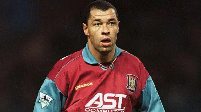 Paul McGrath in action for Aston Villa against Manchester City in a Premier League match