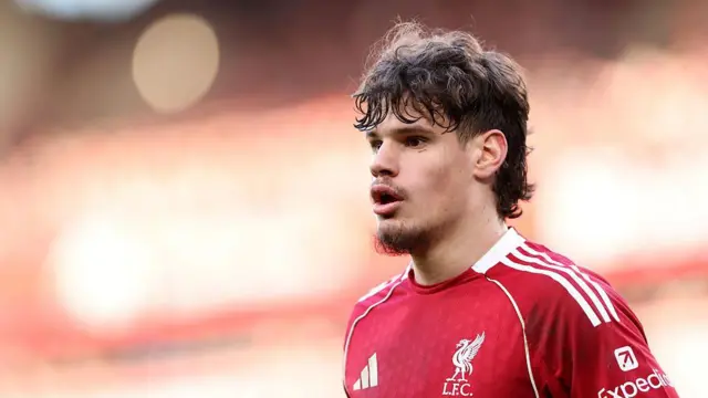Milos Kerkez of Liverpool looks on