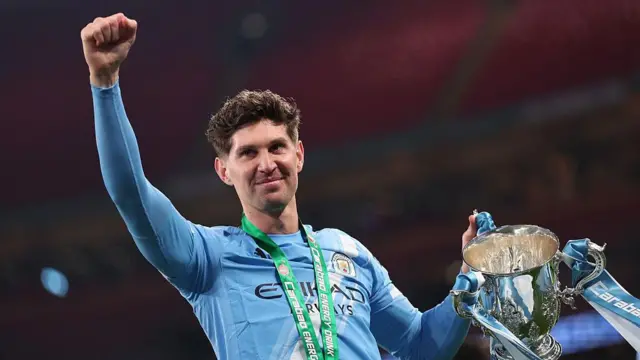 John Stones of Manchester City celebrates with the trophy