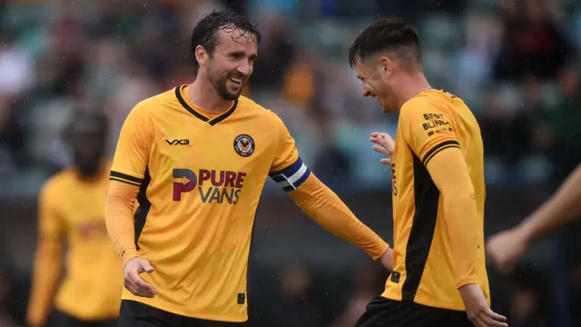 Aaron Wildig celebrates after scoring a pre-season goal for Newport