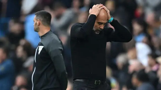 Pep Guardiola reacts to Manchester City v Arsenal at the Etihad stadium. 