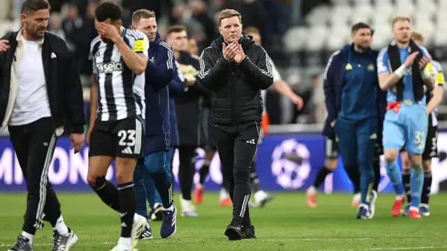 Eddie Howe applauds the fans after full-time