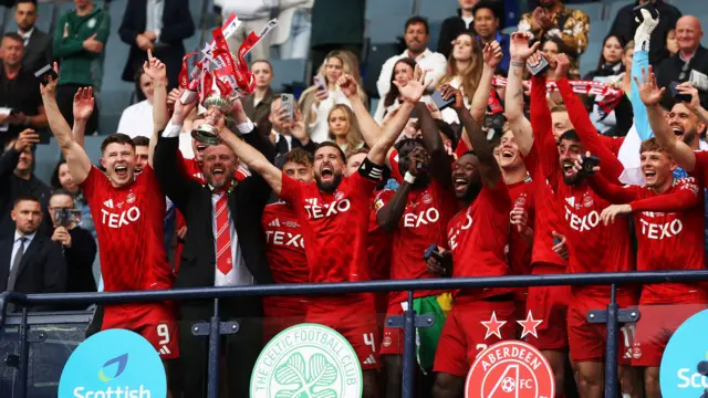 Shinnie lifts the Scottish Cup