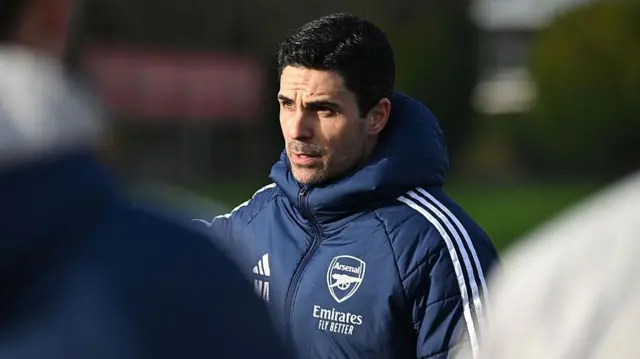 Mikel Arteta looks on