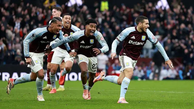 Aston Villa players celebrate scoring