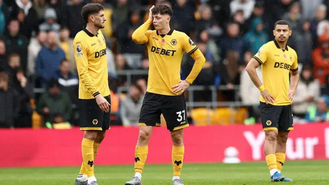 Wolves players look dejected 
