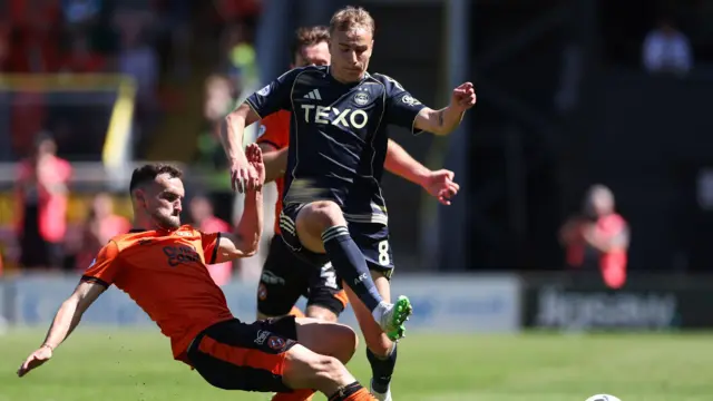 Dundee United's Vicko Sevelj tackles Topi Keskinen