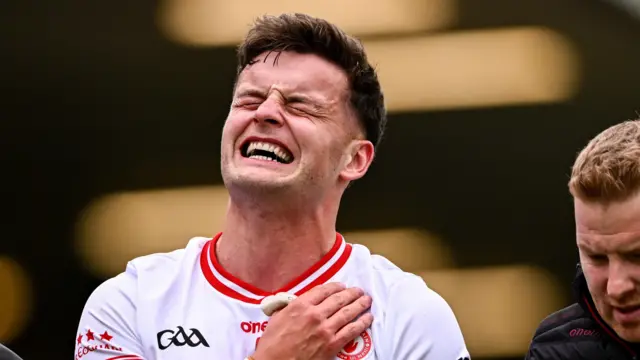 Michael McKernan winces as he leaves the pitch in Tyrone's win over Cavan