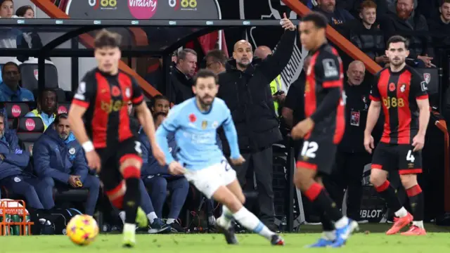 Pep Guardiola, manager of Manchester City sits on the bench during the Premier League match between AFC Bournemouth and Manchester City FC at Vitality Stadium